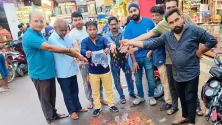 Unique protest by trade association for road construction in Lucknow flowers filled in potholes